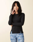 model wears black long sleeve active tee with panels